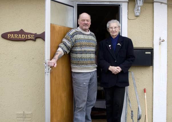Fisherman Michael Forbes with his mother Molly, 92, at his estate in Balmedie, Aberdeenshire. Molly Forbes has refused to sell the land to Donald Trump.