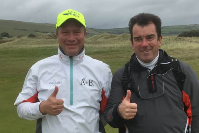 Greig Hutcheon and PGA Cup captain Albert MacKenzie give the thumbs up to Hutcheon securing automatic selection for next year's match at Foxhills