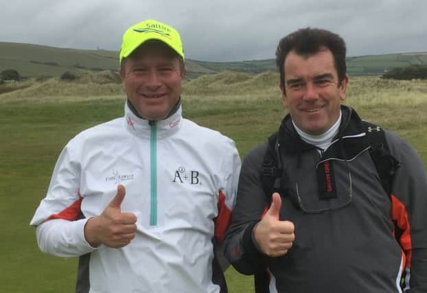 Greig Hutcheon and PGA Cup captain Albert MacKenzie give the thumbs up to Hutcheon securing automatic selection for next year's match at Foxhills