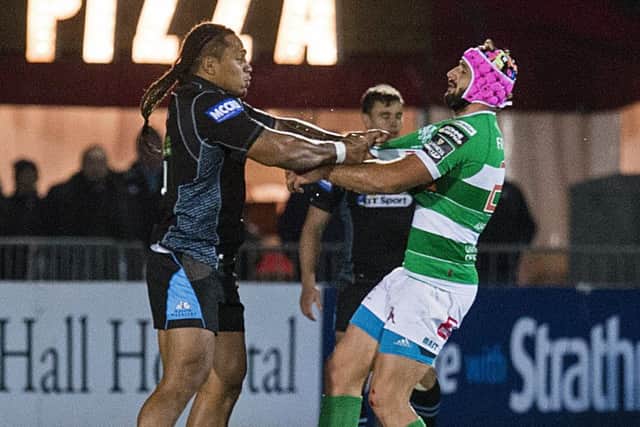 Glasgow's Langilangi Haupeakui tussles with Treviso's Luca Bigi after the Warriors player was shown a red card. Picture: Paul Devlin/SNS