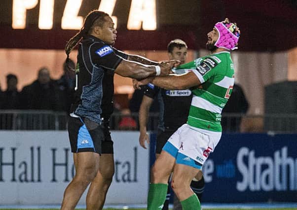 Glasgow's Langilangi Haupeakui tussles with Treviso's Luca Bigi after the Warriors player was shown a red card. Picture: Paul Devlin/SNS
