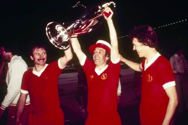 Tommy Smith, Ian Callaghan and Phil Neal of Liverpool parade the trophy after the 1977 European Cup Final. Picture: Getty