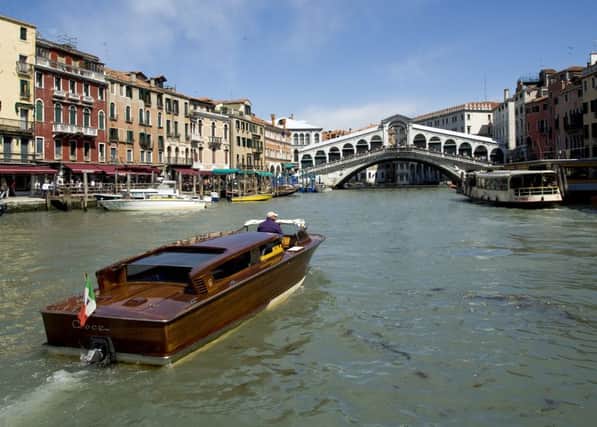 A water taxi in Venice approaches the Rialto Bridge. Picture: Contributed