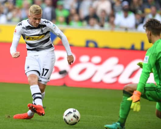 Oscar Wendt  scores against Ingolstadts goalkeeper Oerjan Nyland. Picture: Getty Images)