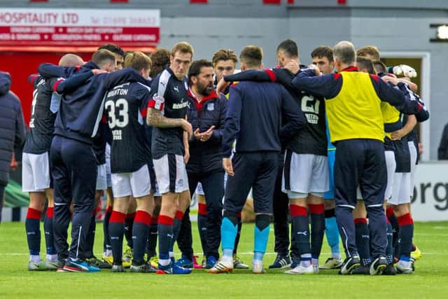 Dundee manager Paul Hartley takes his players into a huddle at full time. Picture: Sammy Turner/SNS Group