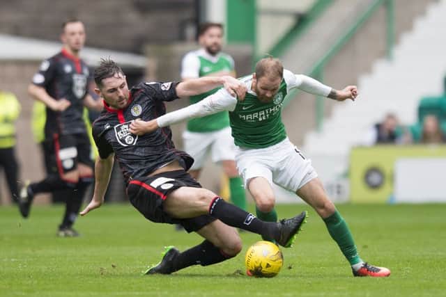 Hibs scorer Martin Boyle battles for control of the ball against St Mirrens Ben Gordon. Photograph: Ross Parker/SNS Group