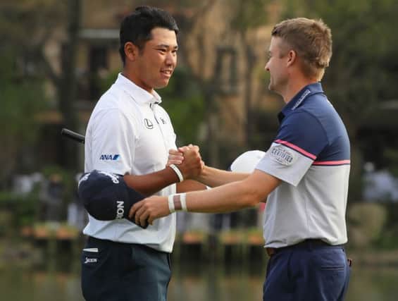 Japan's Hideki Matsuyama is congratulated on his WGC-HSBC Champions success by last year's winner Russell Knox. Picture: Getty Images
