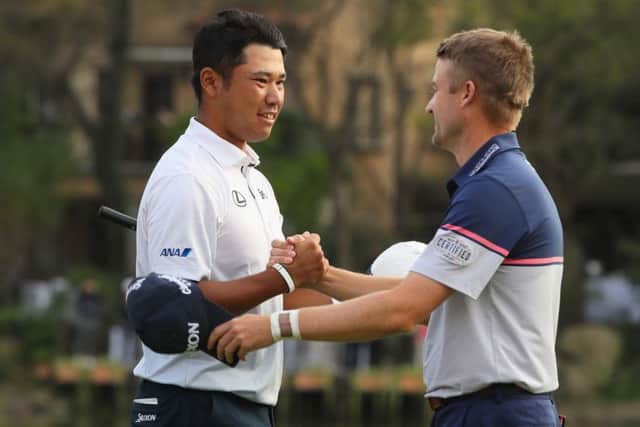 Japan's Hideki Matsuyama is congratulated on his WGC-HSBC Champions success by last year's winner Russell Knox. Picture: Getty Images
