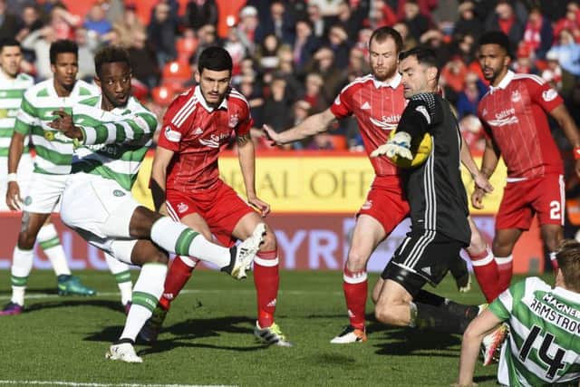 Celtic's Moussa Dembele sees his effort saved by the impressive Joe Lewis. Picture: Craig Williamson/SNS