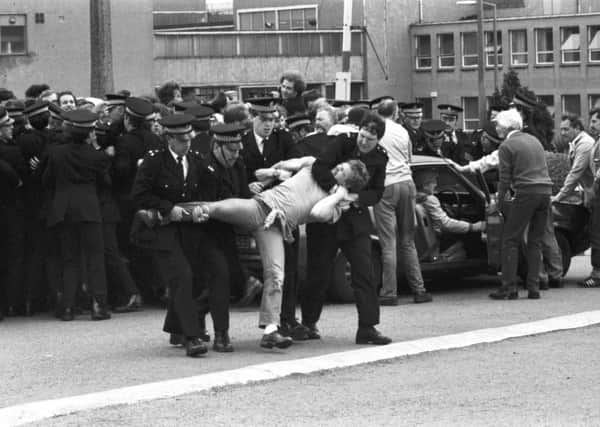 Police officers and miners tussle outside Bilston Glen colliery in June 1984. Picture: TSPL
