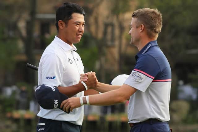 Hideki Matsuyama and Russell Knox shake hands on the 18th green during the final round of the WGC - HSBC Champions. Picture: Getty.