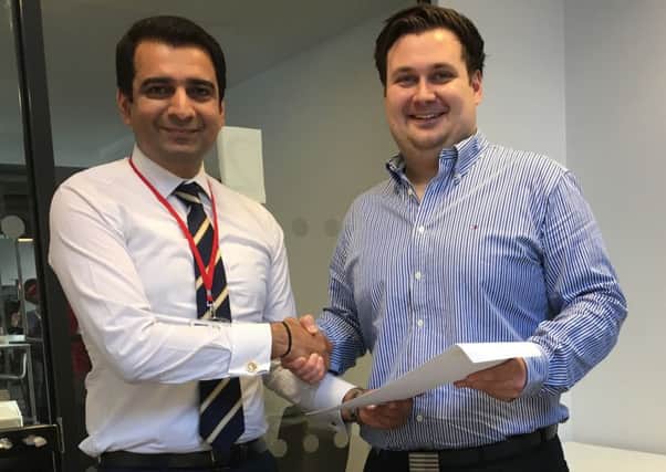 Spectromax chief Bhuwan Kaushik, left, with new hire Lewis Johnston. Picture: Contributed
