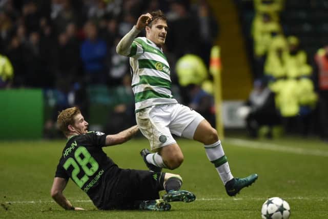 Andre Hahn, left, puts in a challenge on Erik Sviatchenko during the match at Celtic Park two weeks ago. Picture: SNS