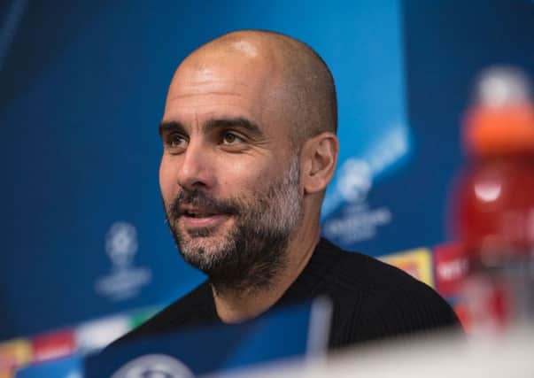 Pep Guardiola is anxious to keep 11 players on the field in Manchester City's clash with Barcelona. Picture: AFP/Getty.