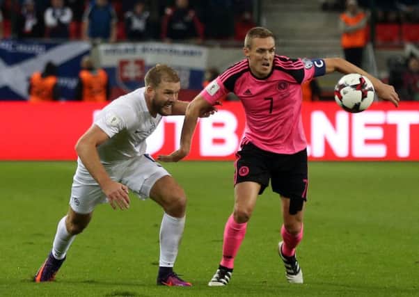 Slovakia's Adam Nemec (L) and Scotland's Darren Fletcher (R) vie for a ball during the WC 2018 football qualification match Picture: Getty Images