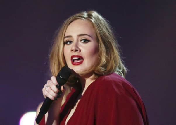 Adele opened up  to Vanity Fair about parenting and her struggle with postpartum depression in an issue for the magazine's December 2016 issue. (Photo by Joel Ryan/Invision/AP, File)