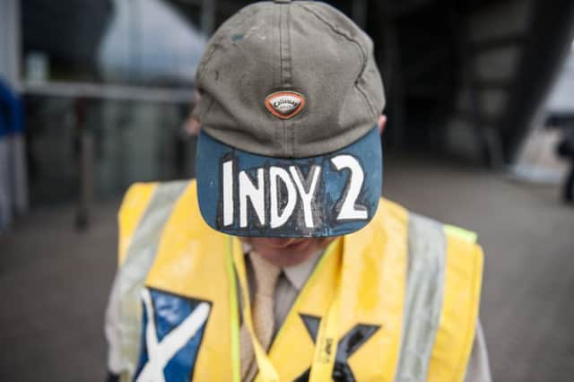 An SNP supporter outside the party's annual conference, which took place in Glasgow in October. Picture: John Devlin/TSPL