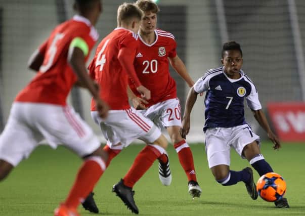 Scotland's Karamoko Dembele challenges Wales' Cavan Williams during the Victory Shield match at Oriam in Edinburgh. Picture: Andrew Milligan/PA Wire