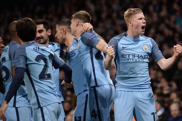 Kevin De Bruyne, right, celebrates after scoring Manchester City's second goal at the Etihad. Picture: AFP/Getty Images
