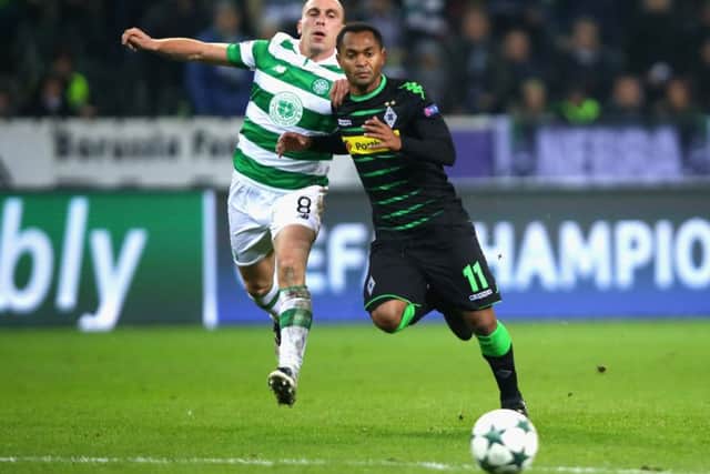 Scott Brown battles for possession during last night's game. Picture: Getty