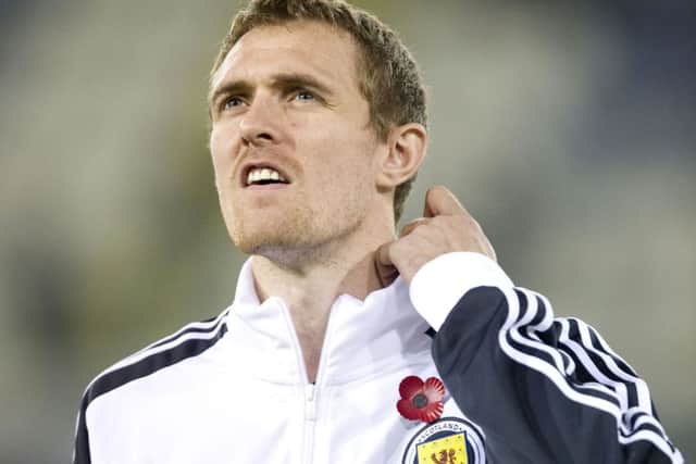 Scotland captain Darren Fletcher wears a poppy on his tracksuit before the match with Cyprus in 2011. Picture: Craig Williamson/SNS