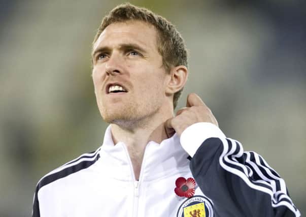 Scotland captain Darren Fletcher wears a poppy on his tracksuit before the match with Cyprus in 2011. Picture: Craig Williamson/SNS