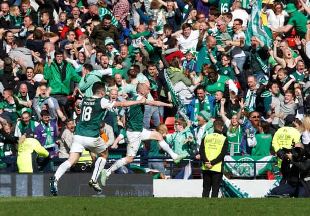 Delirious Hibs fans celebrate after David Gray scores the winning goal in the Scottish Cup final. Picture: Robert Perry