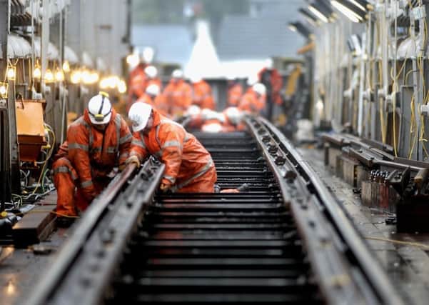 Major Network Rail schemes are nearly Â£400 million over budget, a report claims