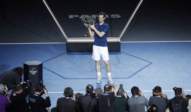 Andy Murray celebrates after defeating John Isner at the final match of the Paris Masters. Picture: AP Photo/Christophe Ena