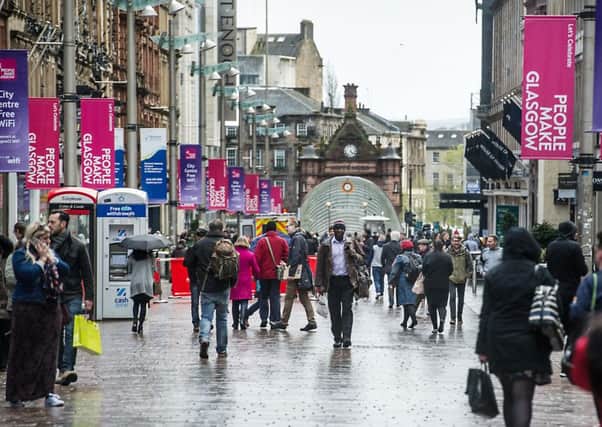 Shoppers in Glasgow are embracing Black Friday but their counterparts in Edinburgh are less keen. Picture: John Devlin