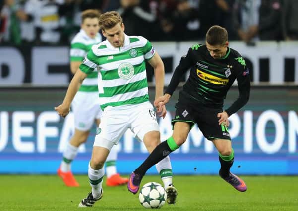Stuart Armstrong, flourishing in his new central role at Celtic, jostles for possession with Thorgan Hazard of Borussia Monchengladbach. Picture: Simon Hofmann/Bongarts/Getty Images