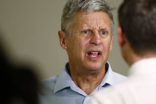 Some Libertarian voters in swing states are agreeing to vote for Clinton if Democrat voters in safe states support Gary Johnson. Picture: AP