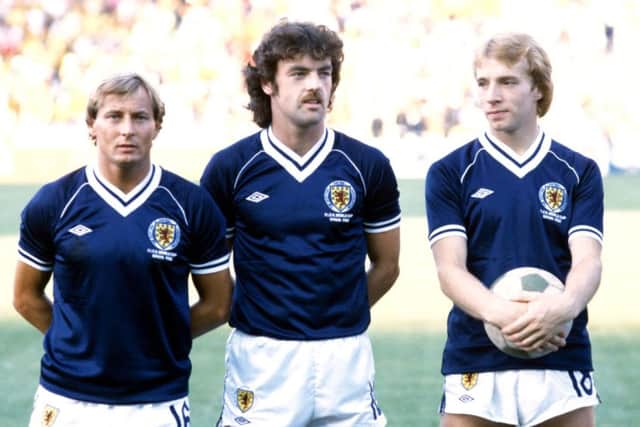 Asa Hartford, left, with John Wark and Steve Archibald prior to his final game for Scotland - a 4-1 defeat by Brazil at the 1982 World Cup in Spain. Picture: SNS Group