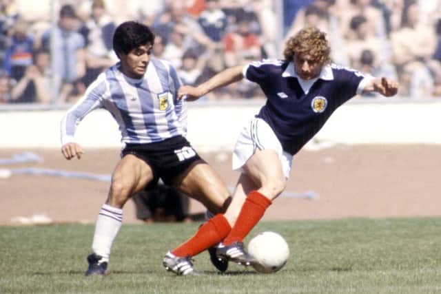 Asa Hartford gets the better of Argentina's Diego Maradona at Hampden in 1979. Picture: SNS Group