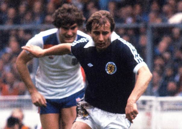 Asa Hartford leaves Glenn Hoddle trailing during Scotland's 1-0 win over England at Wembley in 1981. Picture: SNS Group