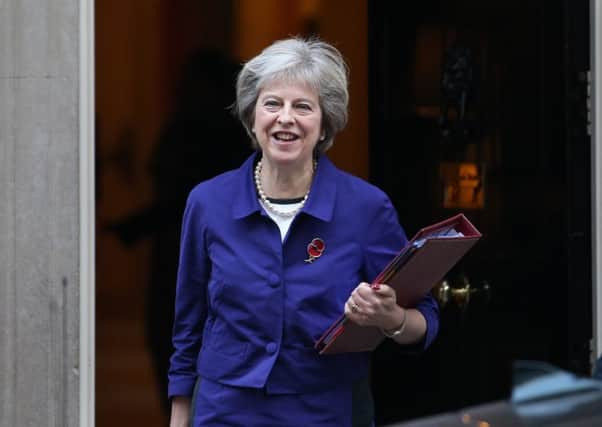 Theresa May has been urged to calm the public backlash over the High Court's Brexit ruling. Picture: AFP/Getty Images