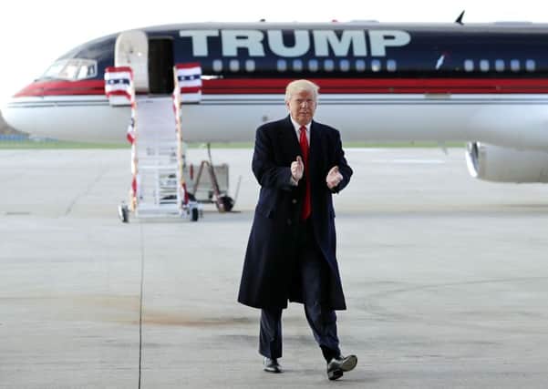 WILMINGTON, OH - NOVEMBER 04:  Republican presidential nominee Donald Trump arrives for a campaign rally at the Airborne Maintenance & Engineering Services hanger November 4, 2016 in Wilmington, Ohio. With less than a week before Election Day in the United States, Trump and his opponent, Democratic presidential nominee Hillary Clinton, are campaigning in key battleground states that each must win to take the White House.  (Photo by Chip Somodevilla/Getty Images)