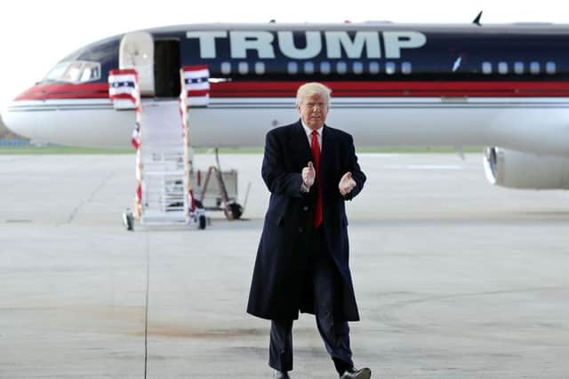 WILMINGTON, OH - NOVEMBER 04:  Republican presidential nominee Donald Trump arrives for a campaign rally at the Airborne Maintenance & Engineering Services hanger November 4, 2016 in Wilmington, Ohio. With less than a week before Election Day in the United States, Trump and his opponent, Democratic presidential nominee Hillary Clinton, are campaigning in key battleground states that each must win to take the White House.  (Photo by Chip Somodevilla/Getty Images)