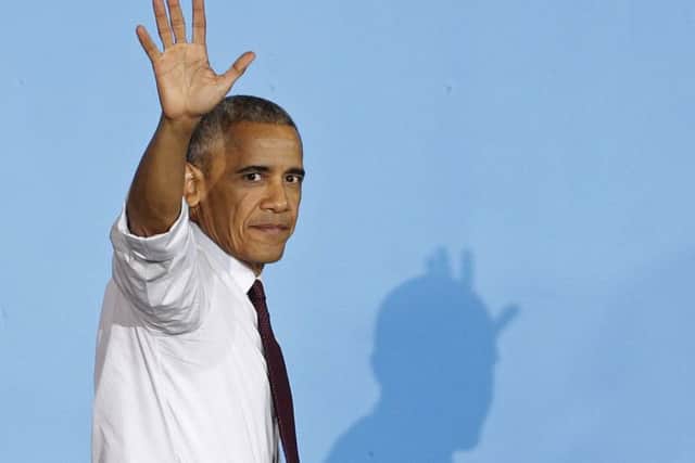 President Barack Obama waves to supporters as he leaves the stage. (AP Photo/Chuck Burton)