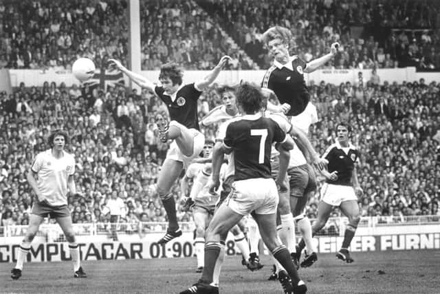 Gordon McQueen soars high above the England defence to give Scotland the lead at Wembley in 1977. Picture: Denis Straughan