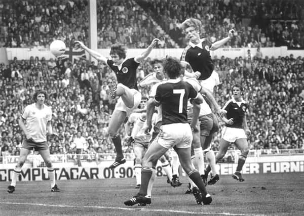 Gordon McQueen soars high above the England defence to give Scotland the lead at Wembley in 1977. Picture: Denis Straughan