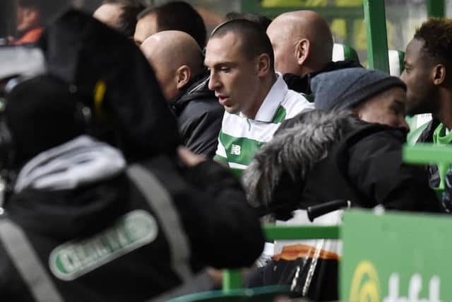 Celtic's Scott Brown takes his place on the bench after going off injured. Picture: Rob Casey/SNS