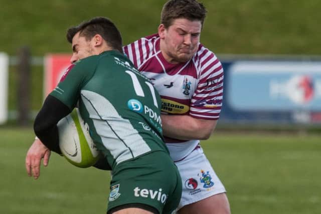 Hawicks Wesley Hamilton is tackled by Darren Miller. Photograph: Ian Georgeson