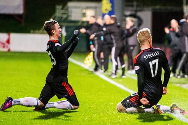 James Maddison, left, celebrates with Jayden Stockley after the former assisted the latter's wonder strike versus Partick Thistle. Picture: SNS/Ross Parker