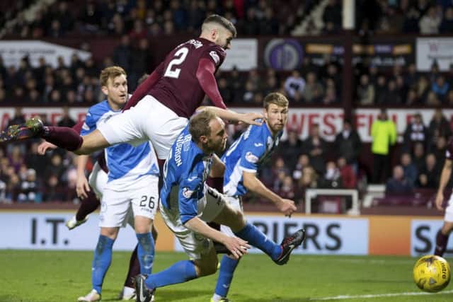 Callum Paterson powers home his late header to secure a draw just after Chirs Kane had put St Johnstone ahead Photograph: Graham Stuart/SNS