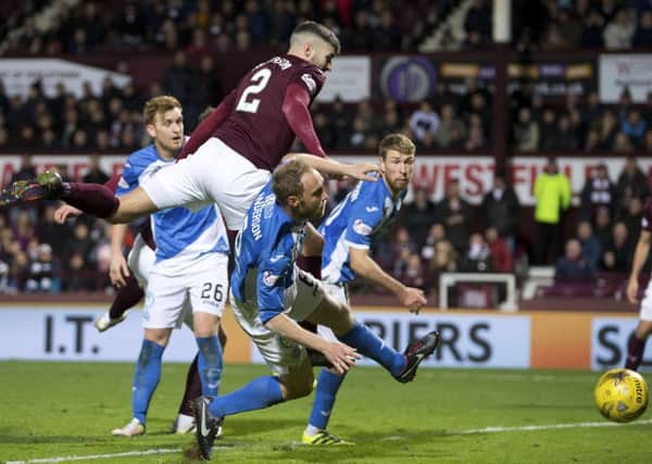 Callum Paterson powers home his late header to secure a draw just after Chirs Kane had put St Johnstone ahead Photograph: Graham Stuart/SNS