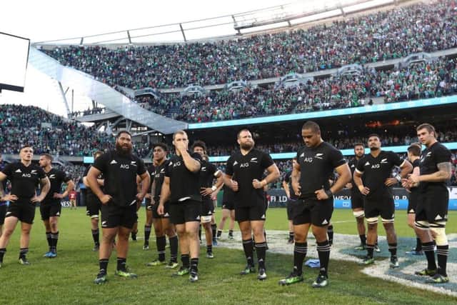 Dejected New Zealand players look on following their team's loss to Ireland. Picture: Phil Walter/Getty Images
