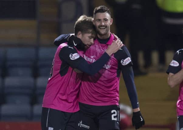 Dundee's Marcus Haber, right, celebrates his clinching goal with Craig Wighton during the win over Motherwell. Picture: SNS