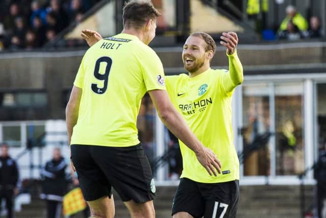 Martin Boyle, right, who scored twice in Hibs 3-0 victory, celebrates with team-mate Grant Holt. Picture: SNS.