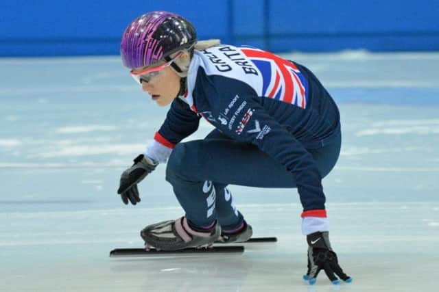 Scotland's Elise Christie struck gold and set two British records at the World Cup event in Calgary Canada.